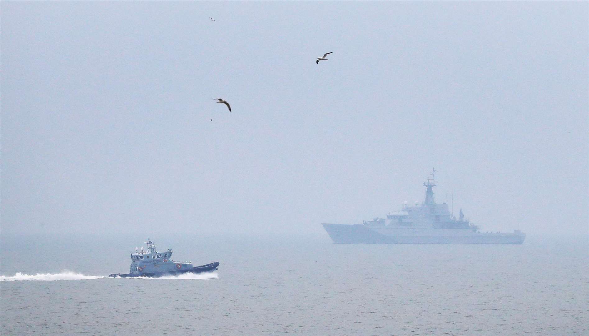 A Border Force patrol vessel and HMS Mersey on patrol in The Channel near Dungeness (PA)