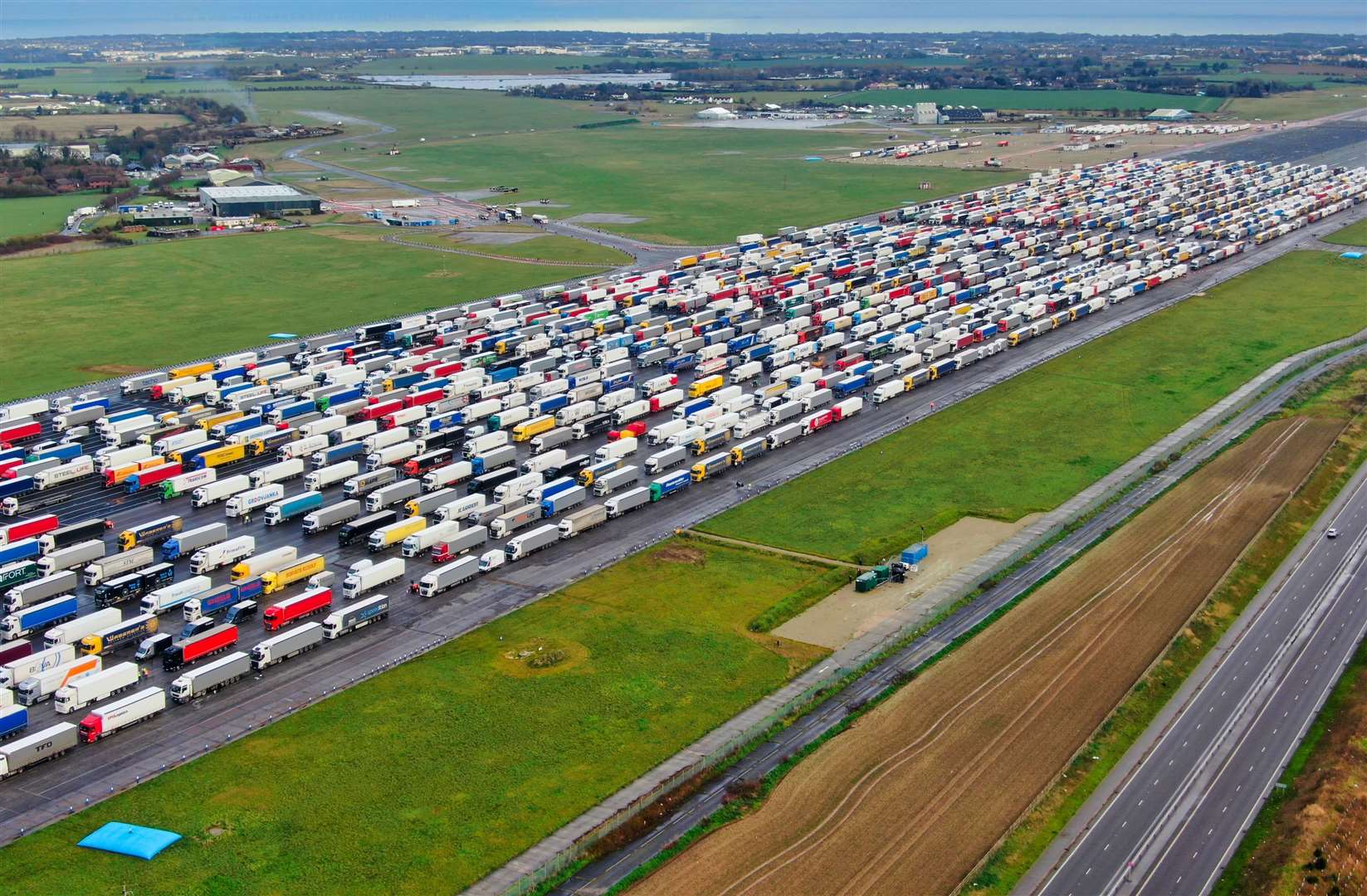 The Manston holding area for Dover-bound trucks - seen here in December - will soon be shut, with all traffic going to Sevington. Picture: Swift Aerial Photography