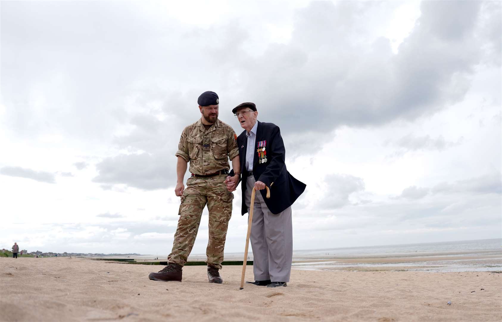 Sergeant Ben Beale and veteran Jack Mortimer on Sword Beach (Jordan Pettitt/PA)