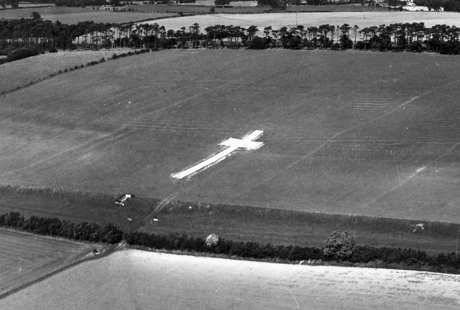 The white cross standing out on the Lenham hillside