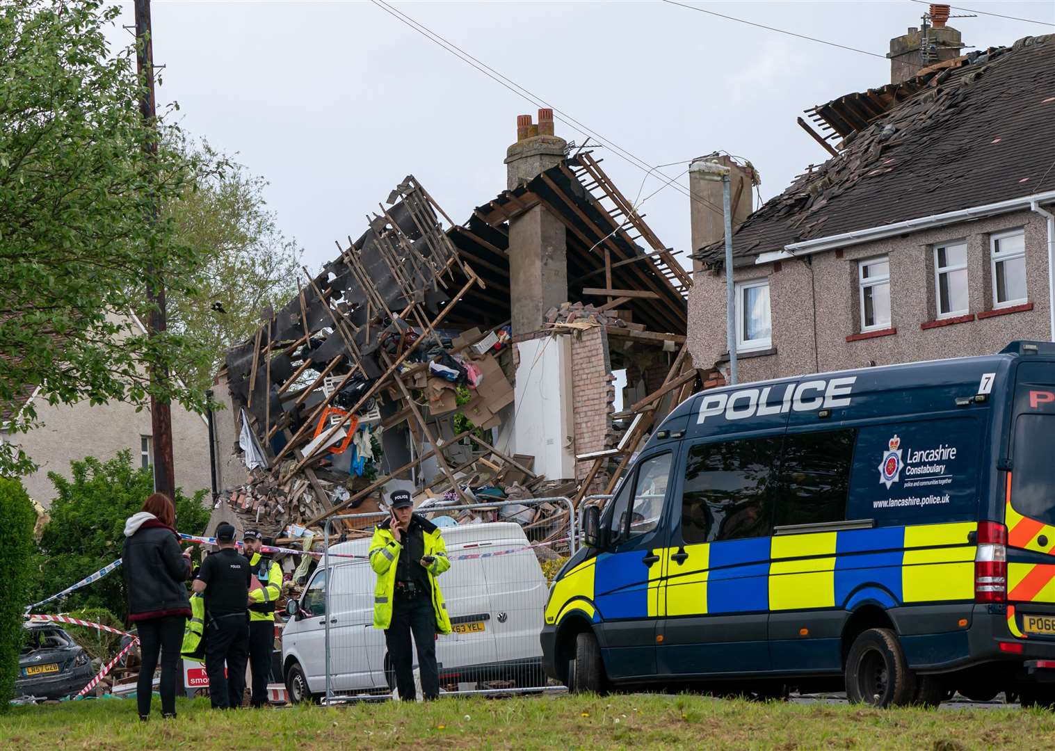 Emergency workers at the scene of the blast (Danny Lawson/PA)