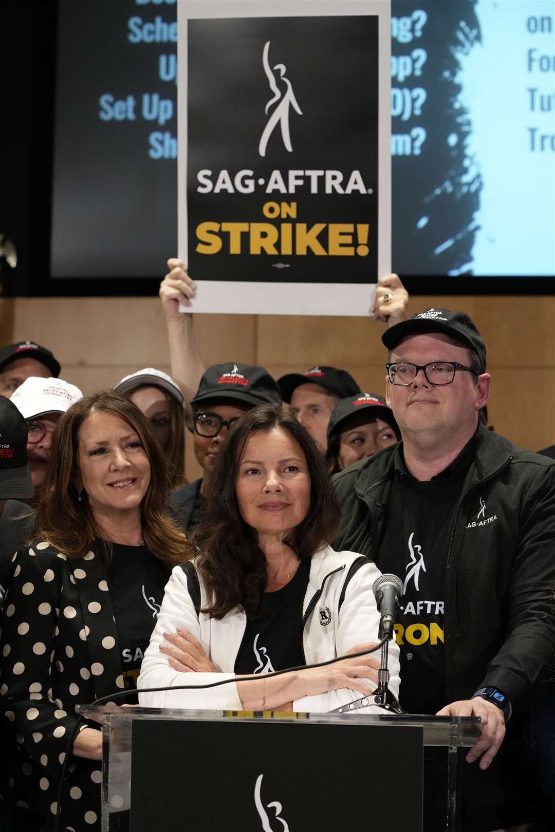 Sag-Aftra president Fran Drescher (centre), and Sag-Aftra chief negotiator Duncan Crabtree-Ireland (right) (Chris Pizzello/AP)