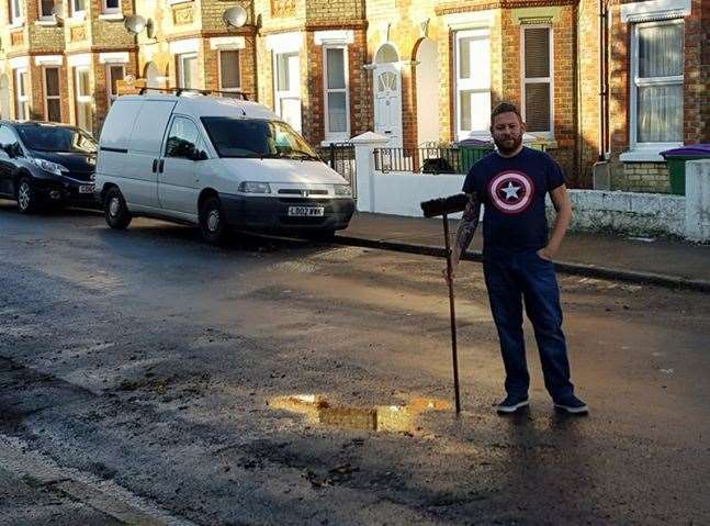 Peter Cunningham took to the street with his broom and swept all the water away (21182101)