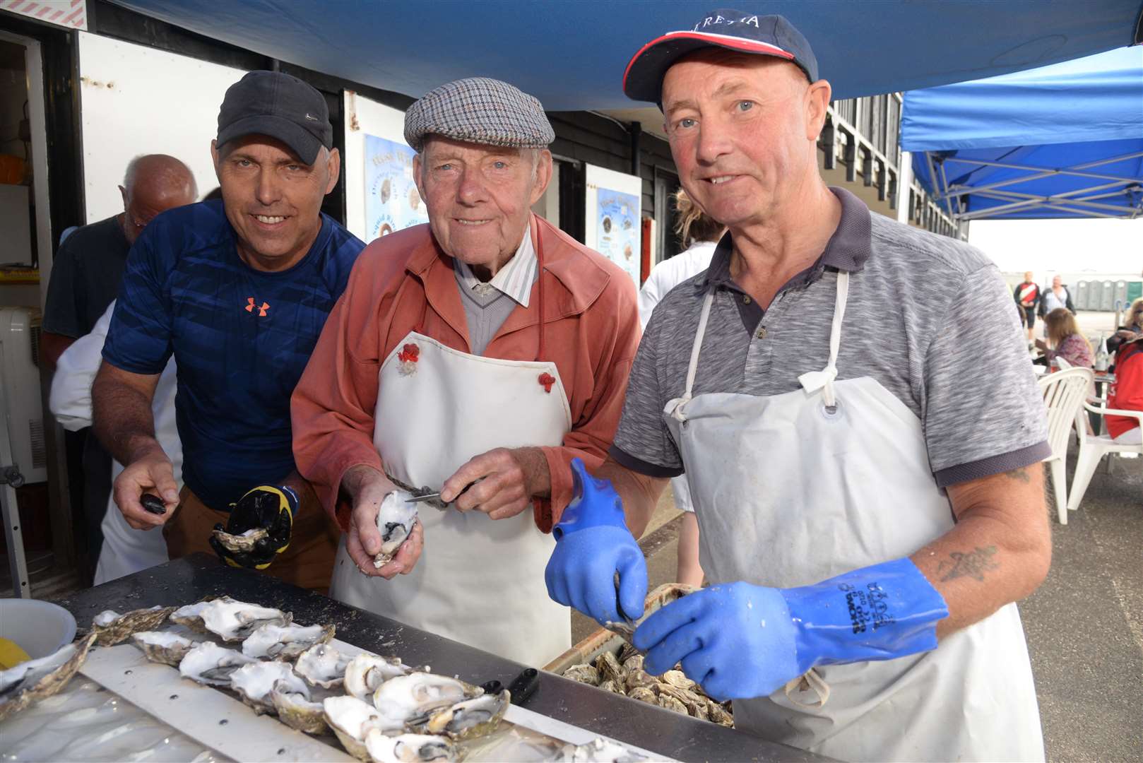 Graham and Derrick West with Andy Riches busy opening oysters at West's Whelks during a previous Oyster Festival