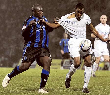 Adebayo Akinfenwa gets to grips with his marker