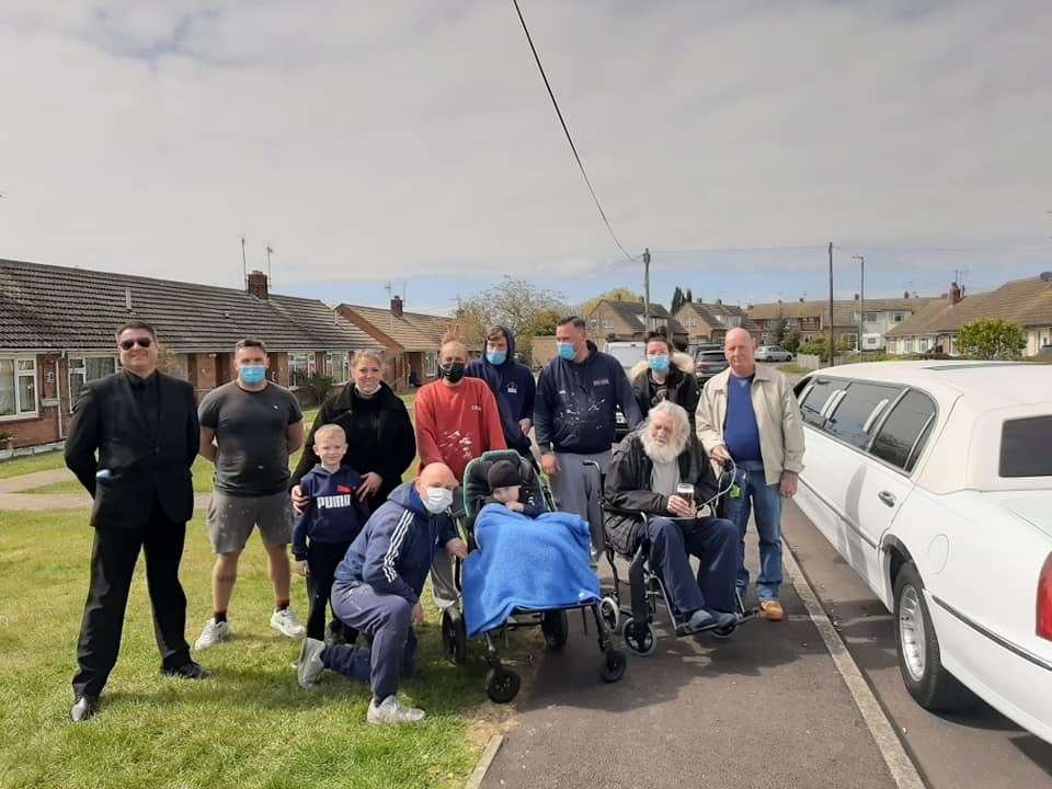 Rocky, front left, and Arthur, front right, with the team of volunteers who helped transform the Minster man's home