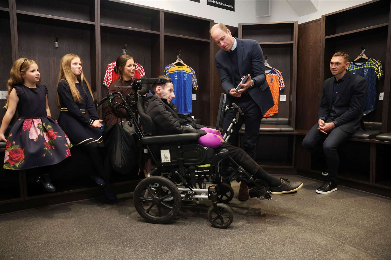 Rob Burrow is made a CBE by the Prince of Wales, with Kevin Sinfield and Lindsey Burrow and children Maya (left) and Macy, in January (Phil Noble/PA)