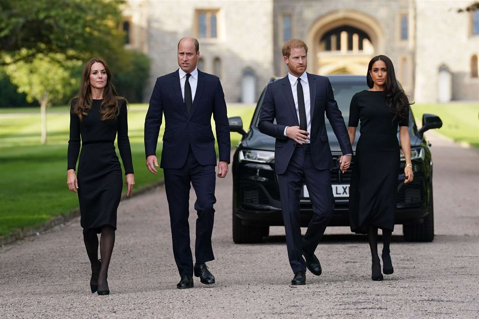 Kate, William, and Harry, then aged 37, and Meghan walk to meet members of the public at Windsor Castle following the death of Queen Elizabeth II in 2022 (Kirsty O’Connor/PA)