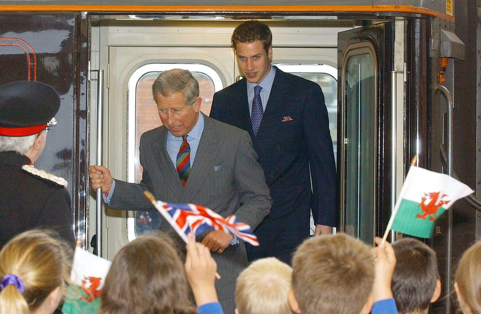 Prince William and Charles arriving at Bangor Station in 2003 (John Giles/PA)