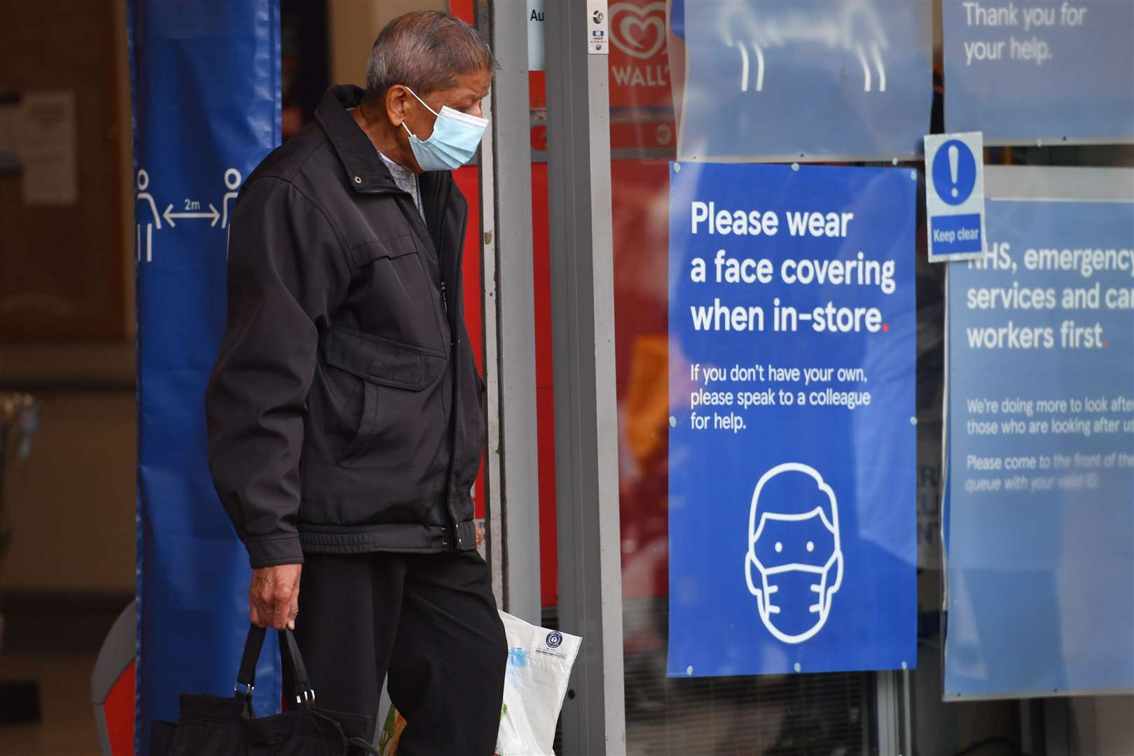 Masks will no longer be legally required on public transport and indoor venues in Scotland from March 21 (PA)