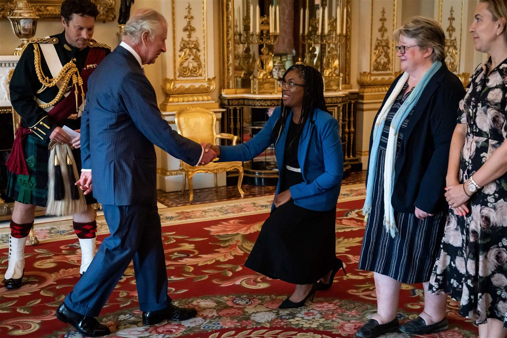 The King greets Secretary of State for Business and Trade Kemi Badenoch (Aaron Chown/PA)