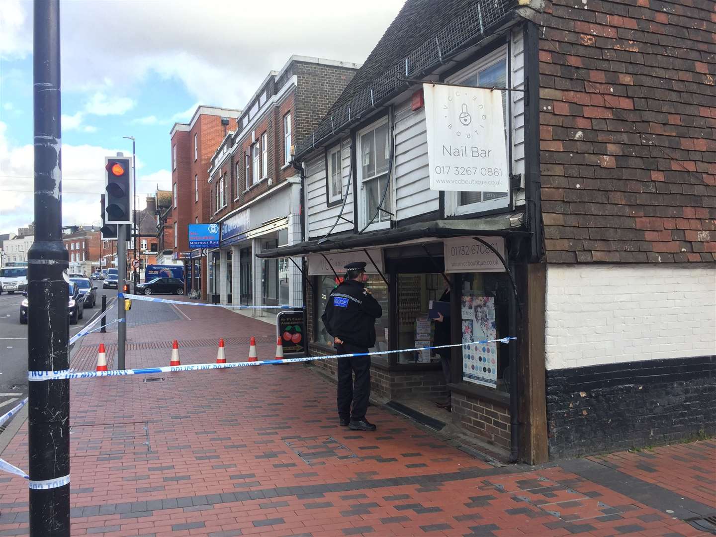 Police outside the nail bar in Tonbridge High Street at the time