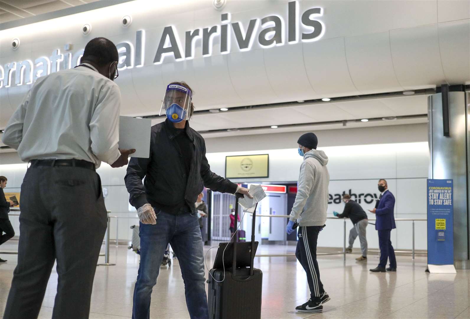 Passengers arriving in the UK have to self-isolate for 14 days (Steve Parsons/PA)