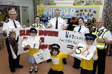 Competition winner Danielle Edwards with runners up Brooke Roberts and Finley Fordham with Hersden warden Ken Campbell, PCSO Sue Radcliffe, Ch Insp Mark Harrison, PCSO Kelly Greenwood and PCSO supervisor Dave Garland at the road safety competiotion presentation at Hersden School on Friday