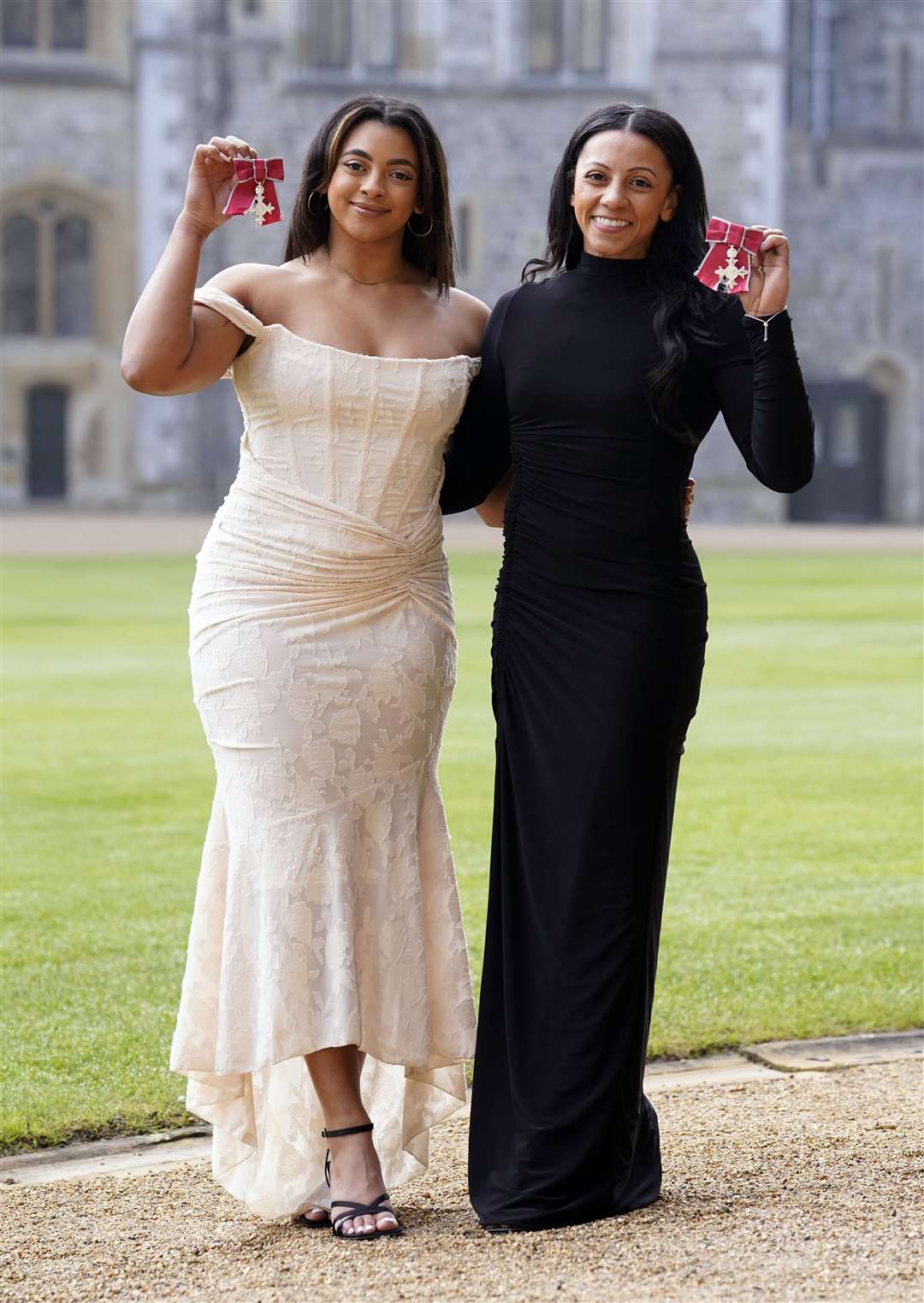 Ellie Downie, left, and Becky Downie after being made Members of the Order of the British Empire during an investiture ceremony at Windsor Castle (Andrew Matthews/PA)