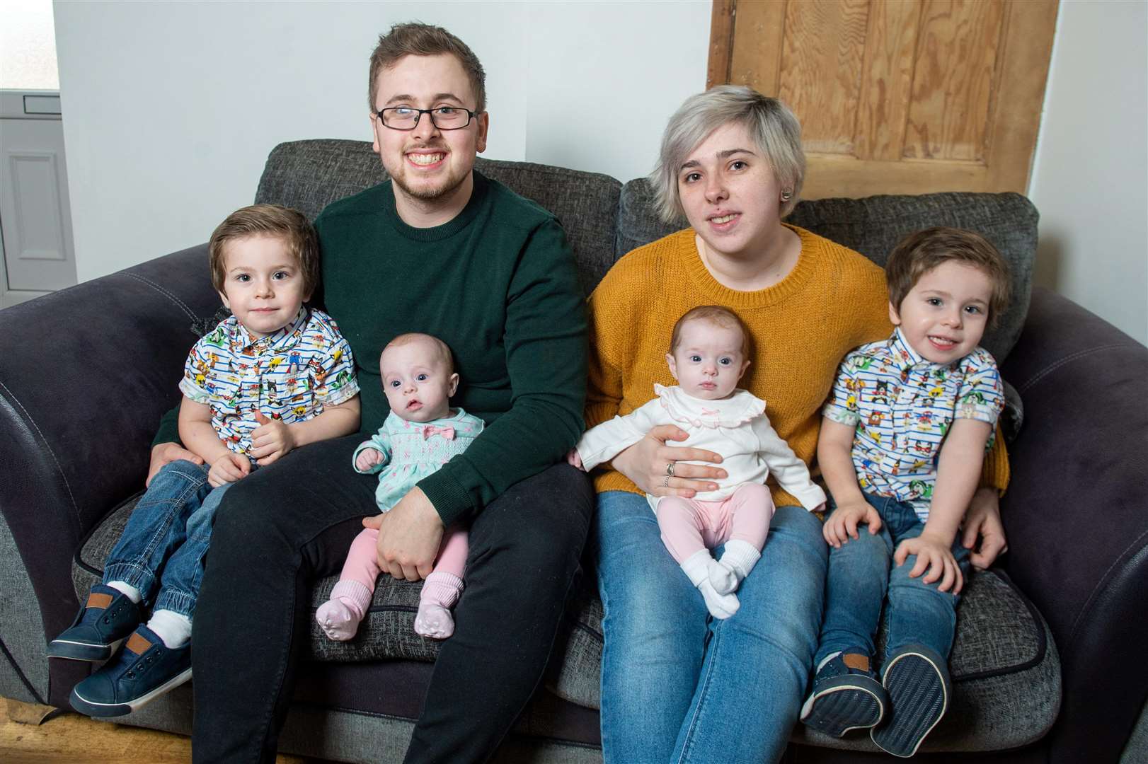 Parents Jessica Phoenix and Liam McMahon with their two-year-old twins Harry and Elijah and their younger twin siblings Phoebe and Aria. Picture: SWNS