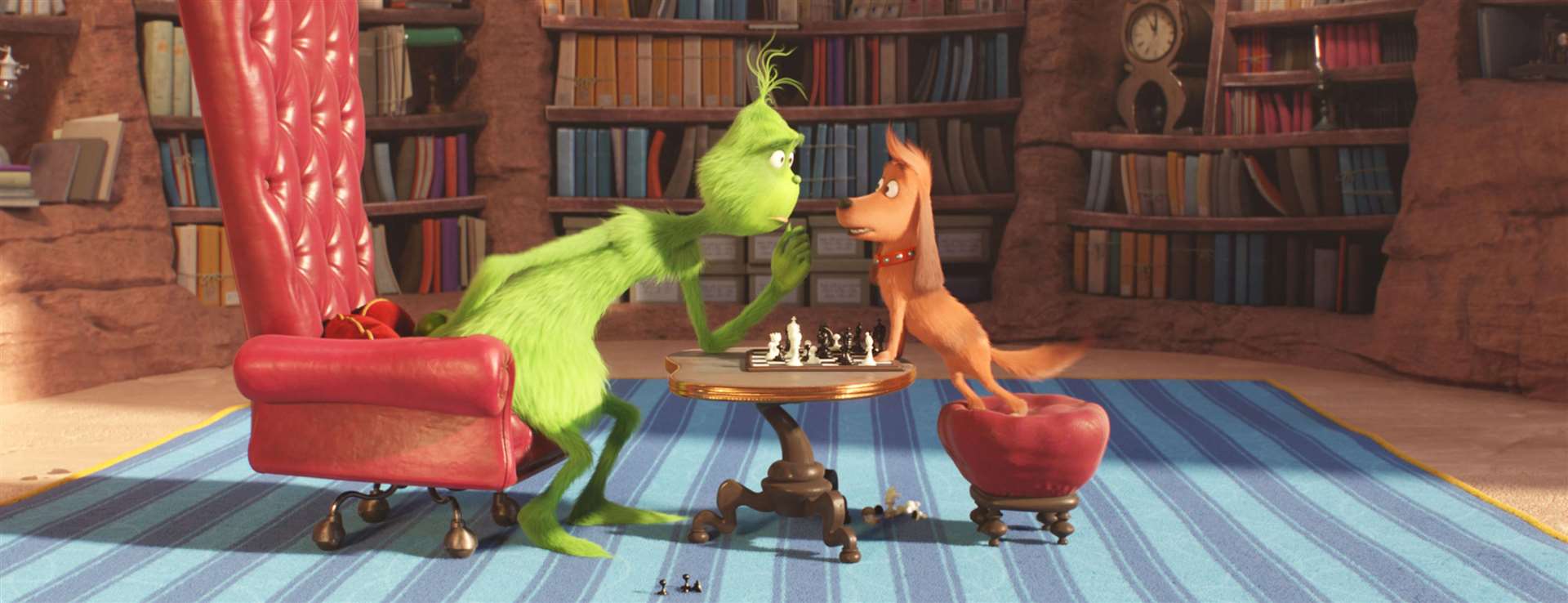 The Grinch (voiced by Benedict Cumberbatch) and trusty pooch Max play chess. Picture: PA Photo/Universal Pictures/Illumination/Dr Seuss Enterprises.