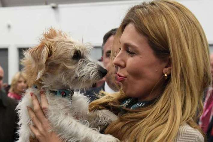 Ms Symonds with her dog Dilyn (Stefan Rousseau/PA)