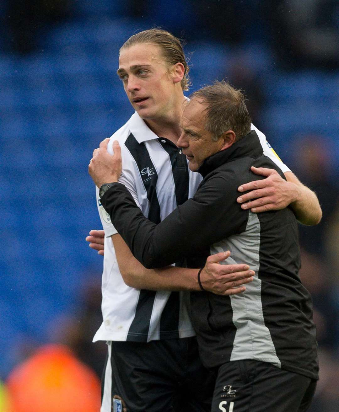 Tom Eaves celebrates with Gills boss Steve Lovell after the win at Pompey Picture: Ady Kerry