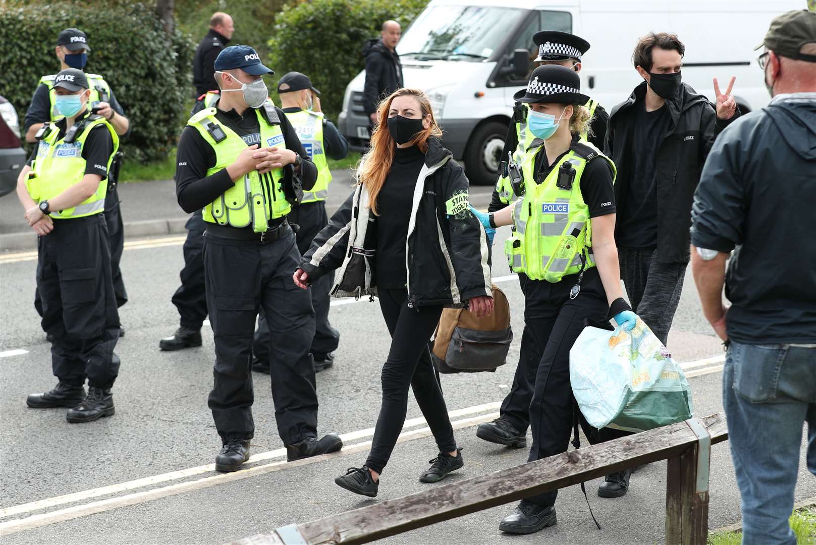 One protester is led away by police outside the Newsprinters printing works at Broxbourne, Hertfordshire (Yui Mok/PA).