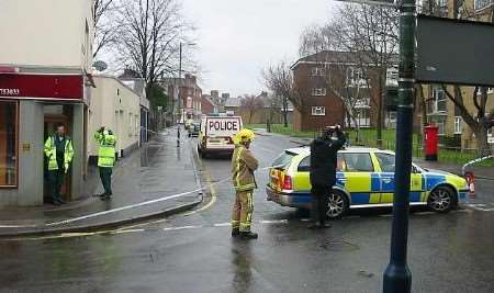 Police at the scene before the package was declared safe