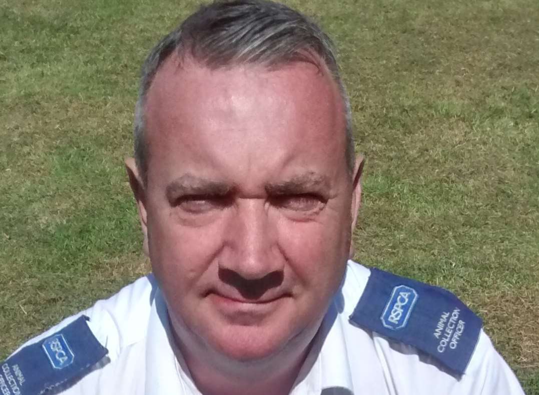 RSPCA collection officer Brian Milligan and the hedgehog.