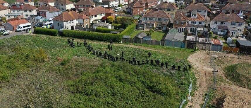 A field in Aylesham is being combed by police this afternoon. Picture: UKNIP