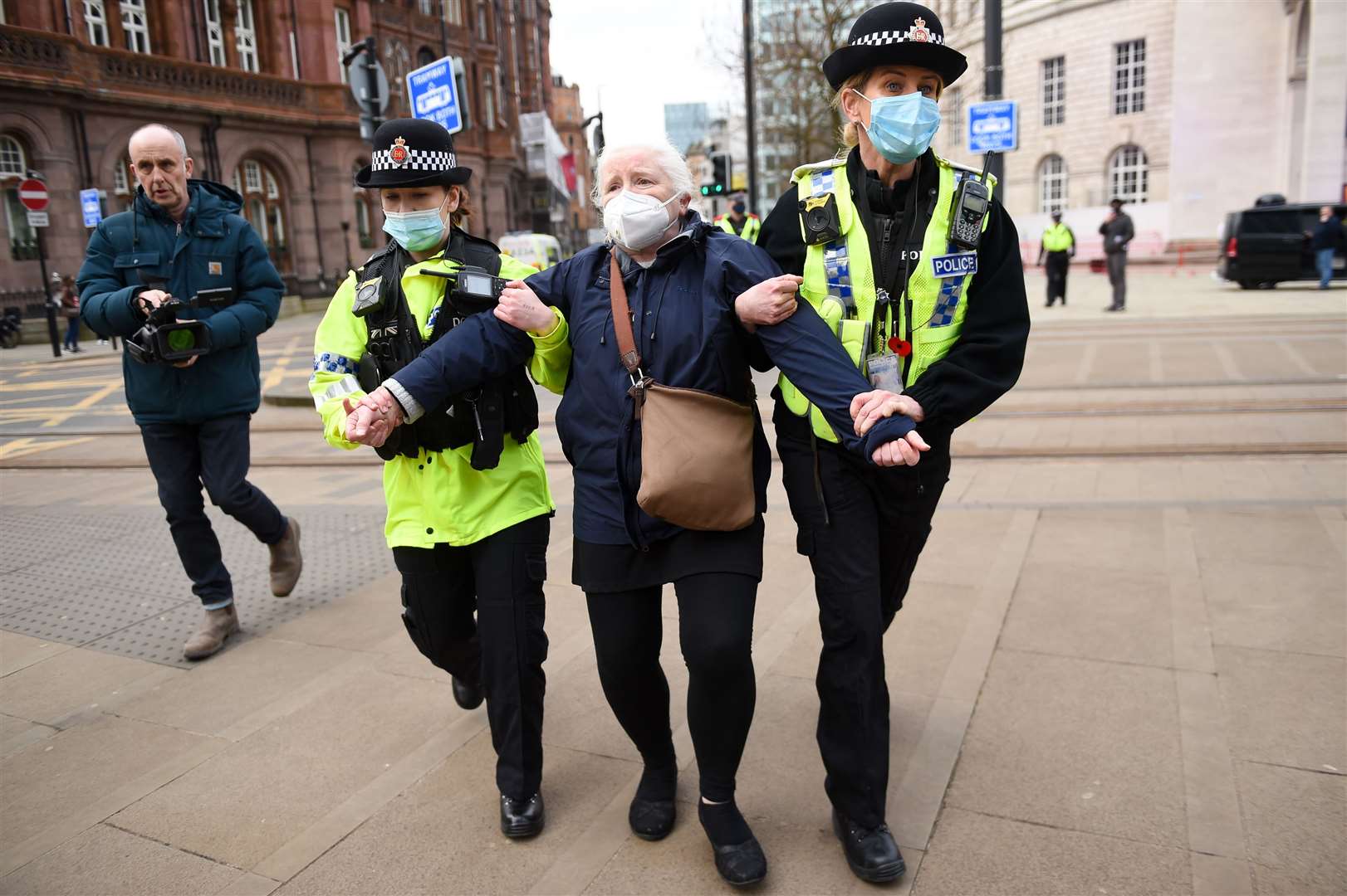 Police detain an NHS worker after breaking up a protest in Manchester over the proposed 1% pay rise for NHS workers from the Government (Jacob King/PA)