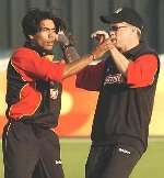 EARLY HOPE: Mohammad Sami and David Fulton celebrate the opening victory against Gloucestershire. Picture: ADY KERRY