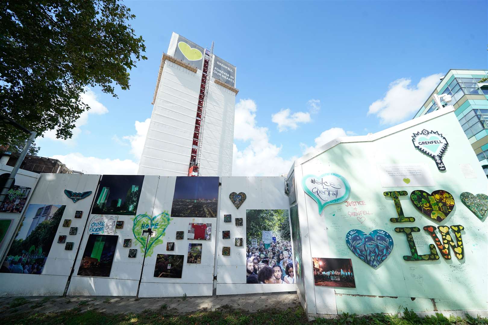 The Grenfell Memorial Wall in west London in the shadow of the tower block (Lucy North/PA)