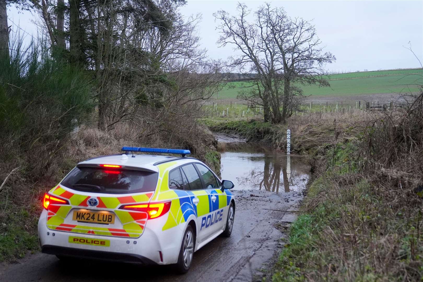 Police at the scene at River Aln near Alnwick, Northumberland (Owen Humphreys/PA)