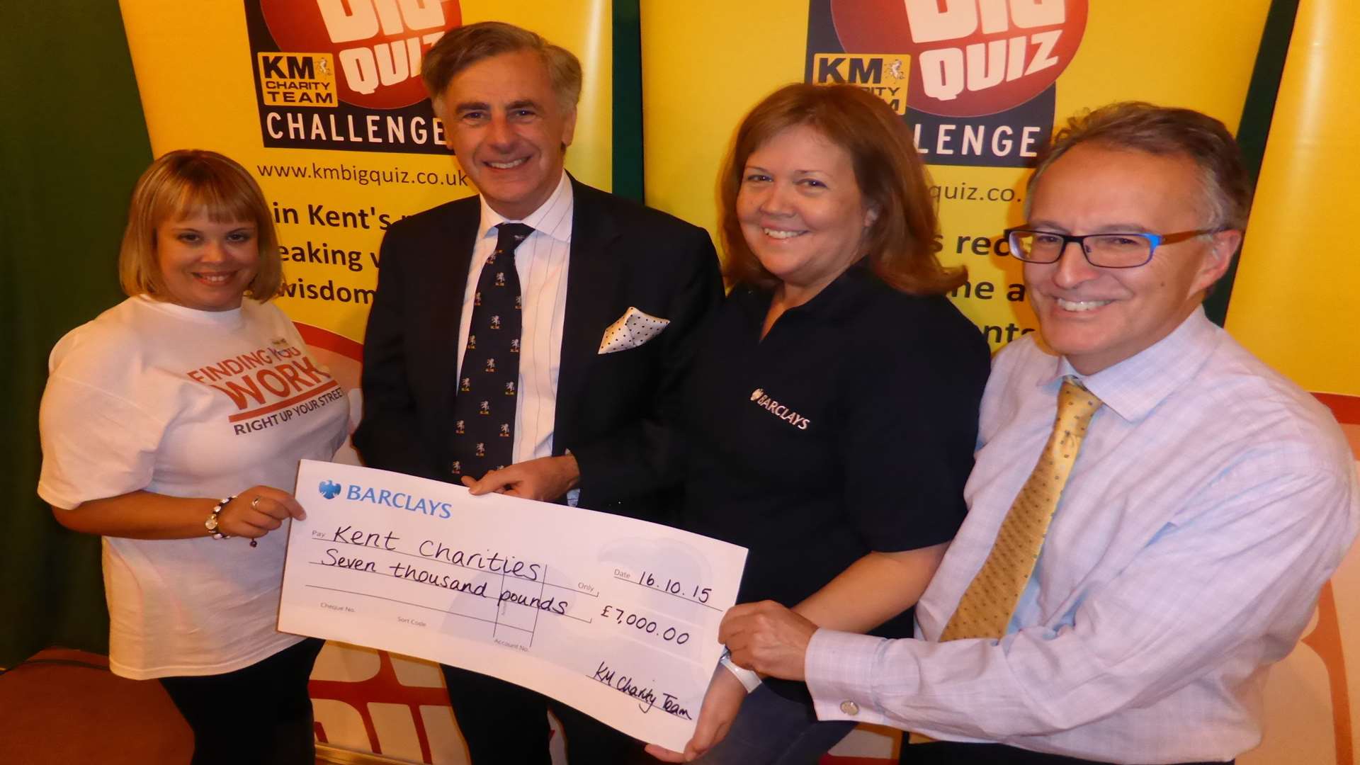 The KM Ashford Big Charity Quiz raised £7,000 for good causes. Event partners Carly James of HR GO, Richard Rix of Hallett and Co, Beverley Walsh of Barclays and Clive Perry of Specsavers announce the figure raised.