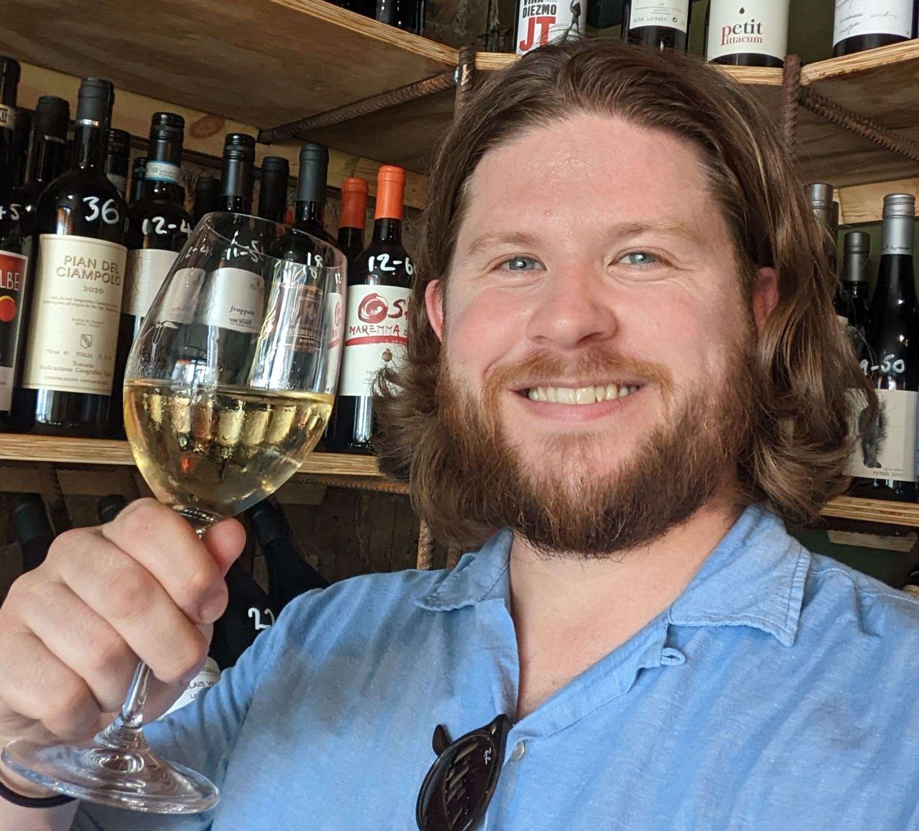 Reporter Rhys Griffiths raises a glass at a new independent wine shop and tasting room in Sandgate