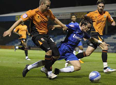 Luke Rooney is brought down during Gillingham's 3-1 defeat to Barnet