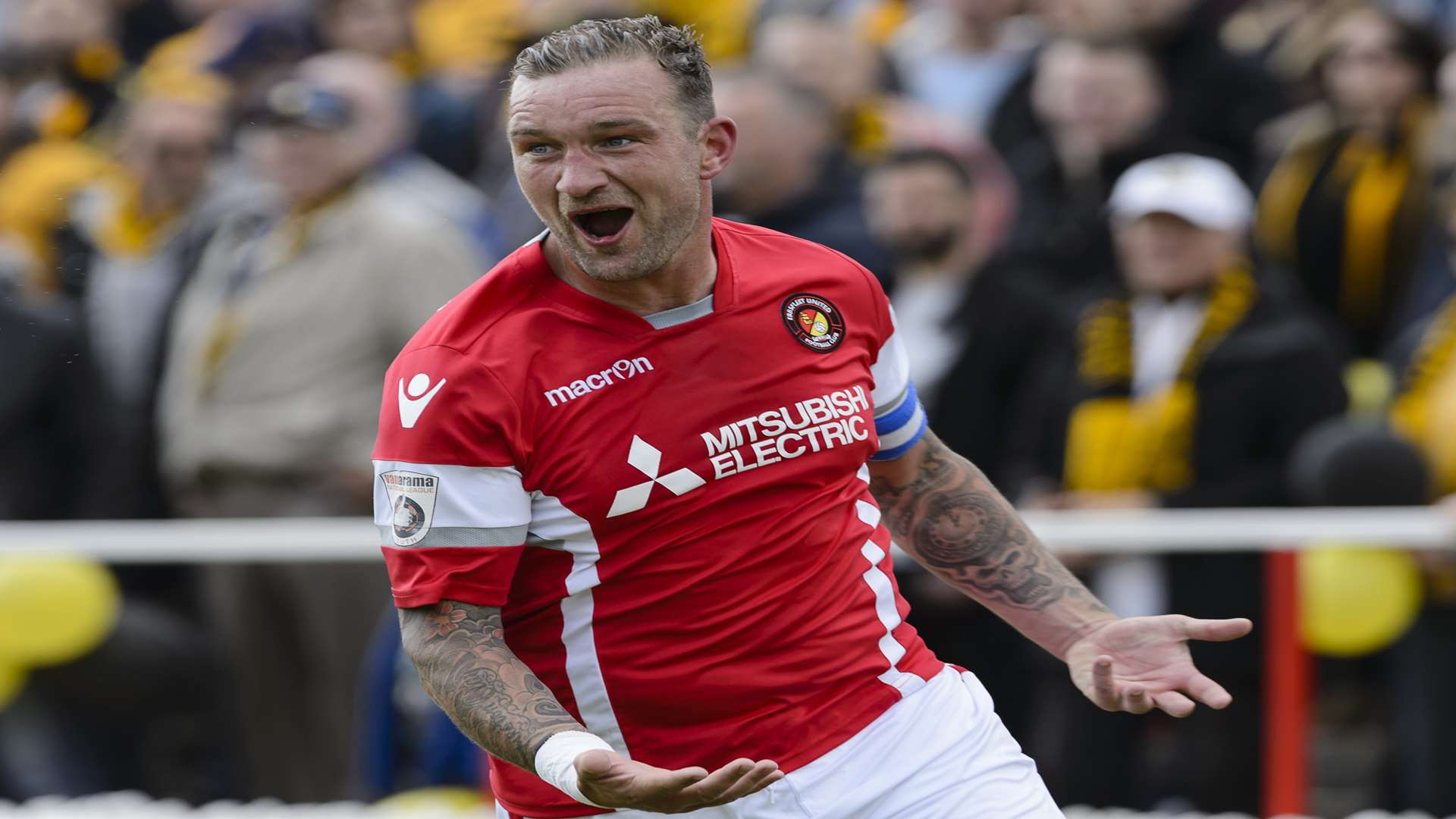 Danny Kedwell wheels away after scoring from the penalty spot to put Fleet 1-0 up. Picture: Andy Payton