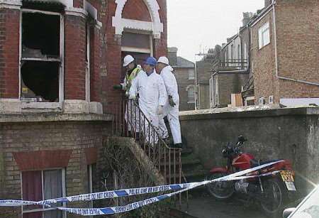 Investigators at the scene of the tragedy. Picture: MIKE PETT