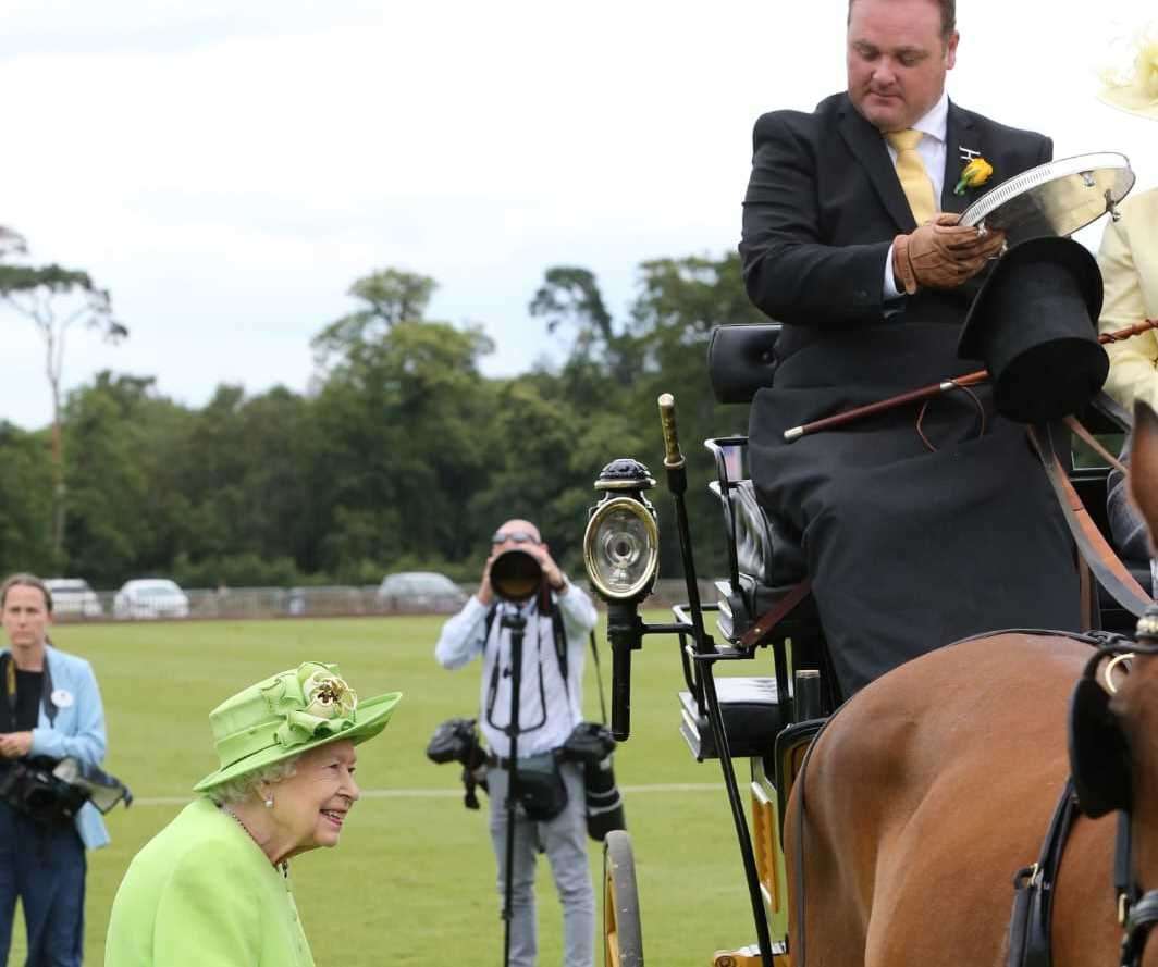 Smiles from the Queen, watched by Michael Malone. Picture: Paul Orchard