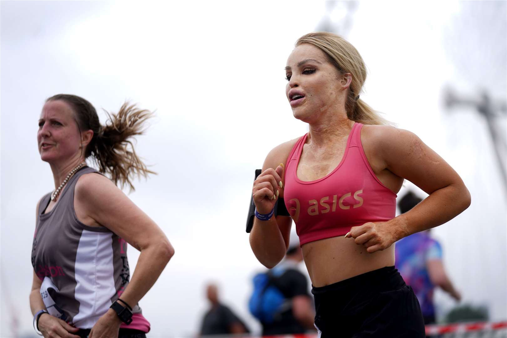 TV presenter and activist Katie Piper (right) crosses Westminster Bridge (Victoria Jones/PA)