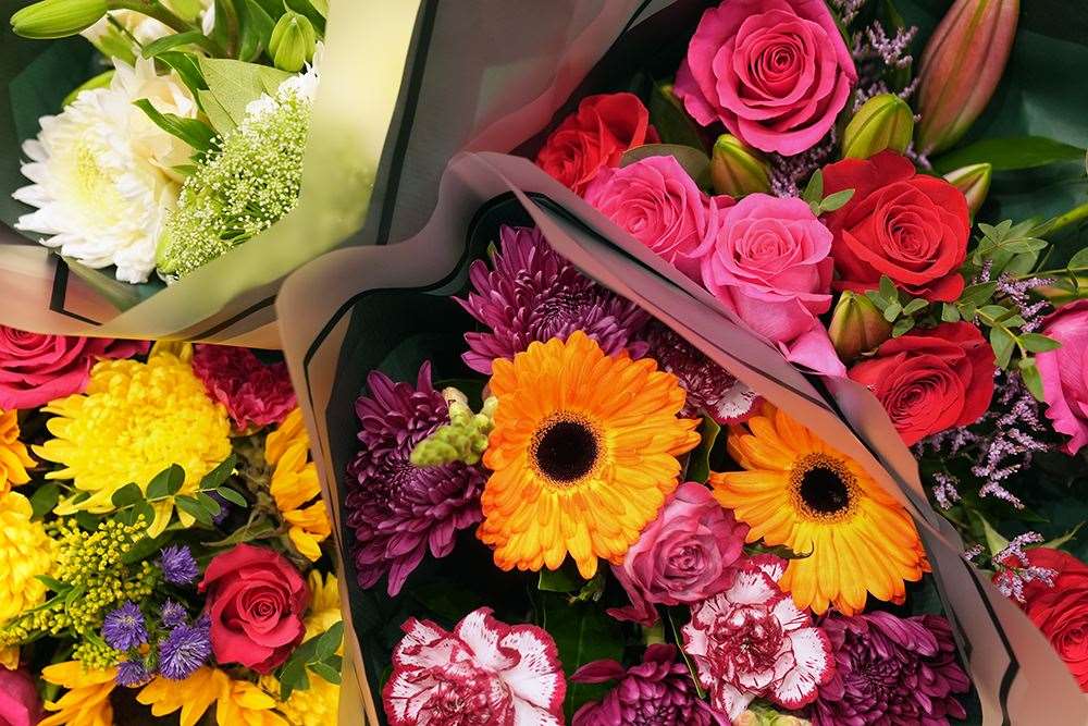 Bouquets of flowers sold by Tesco on view at the chain’s main supplier (Joe Giddens/PA)