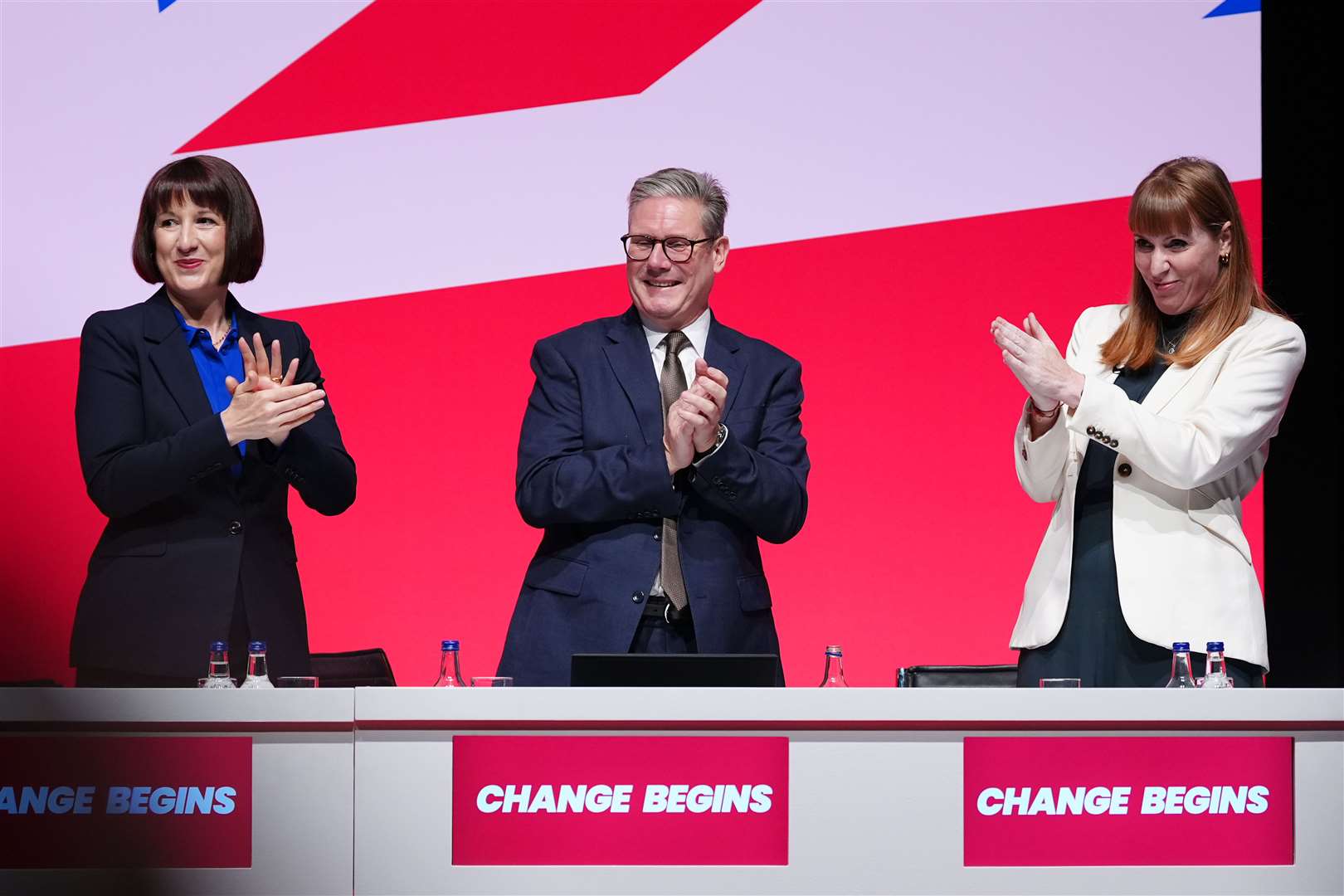 (left to right) Chancellor of the Exchequer Rachel Reeves, Prime Minister Sir Keir Starmer and Deputy Prime Minister Angela Rayner clap their hands during the Labour Party Conference in Liverpool (Peter Byrne/PA)