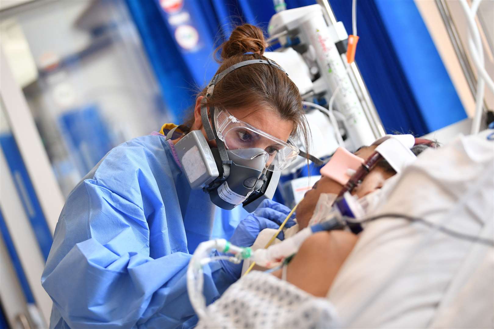 Clinical staff as they care for a patient at the Intensive Care Unit at the Royal Papworth Hospital in Cambridge (Neil Hall/PA)