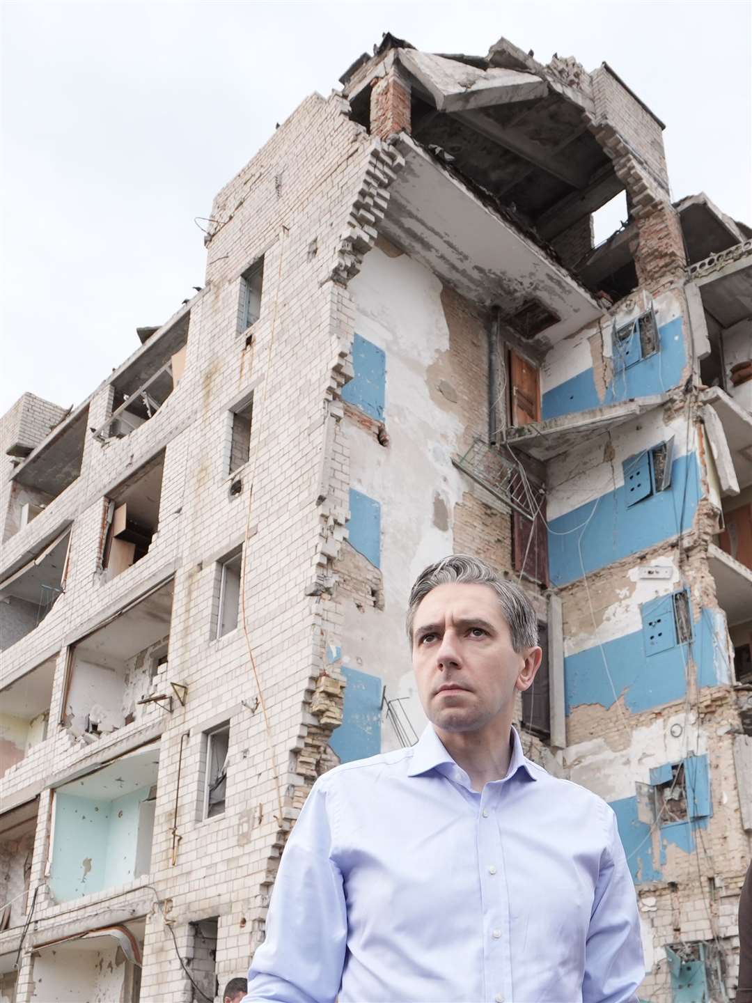 Taoiseach Simon Harris during a visit to inspect damage to buildings in Borodyanka (Stefan Rousseau/PA)