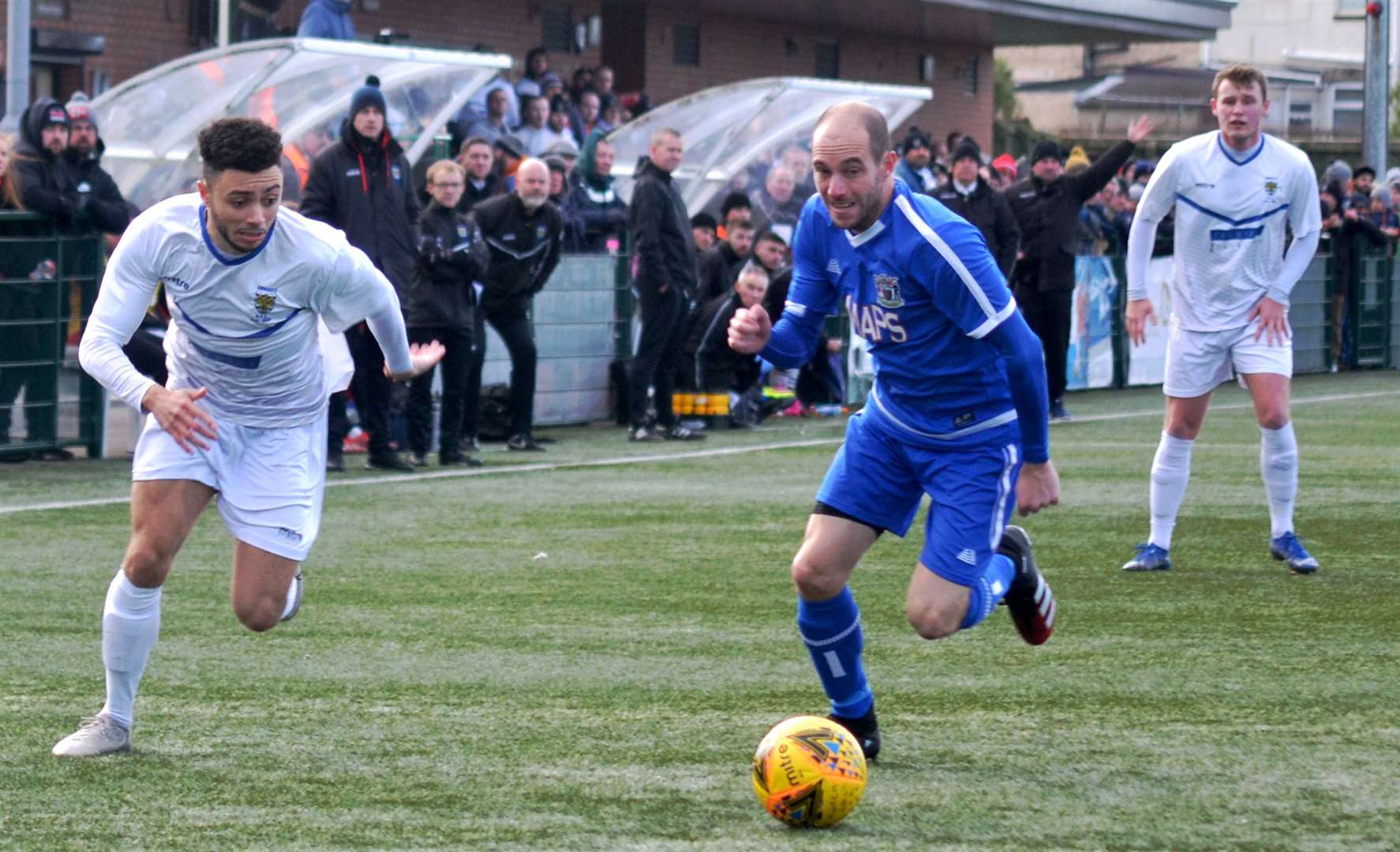 Deal Town's Steve O'Brien (blue) and Consett's Jermaine Metz in a sprint race during Saturday's FA Vase fifth round tie Picture: Gary Welford