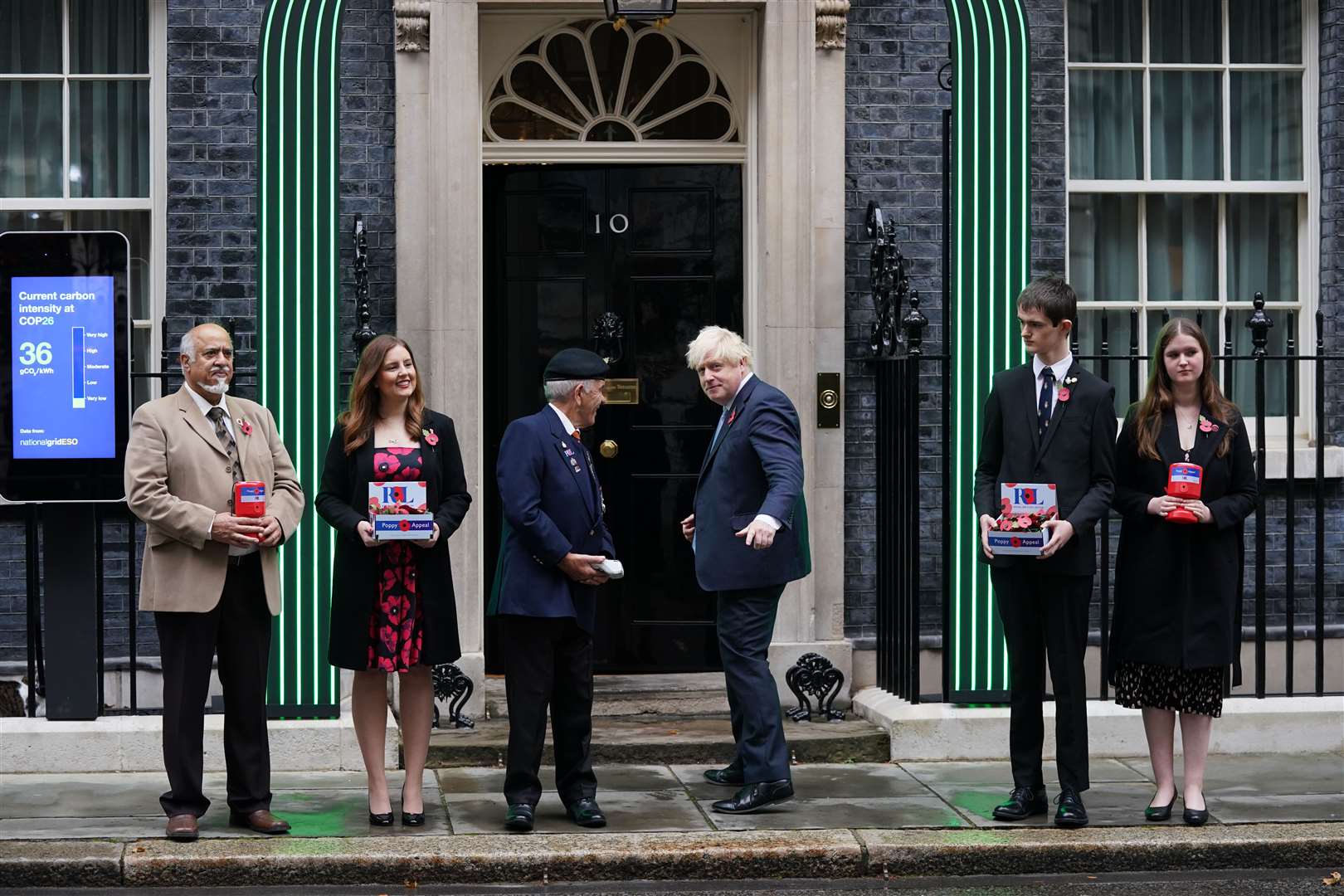 Prime Minister Boris Johnson met five poppy appeal fundraisers outside Number 10 (Steve Parsons/PA)