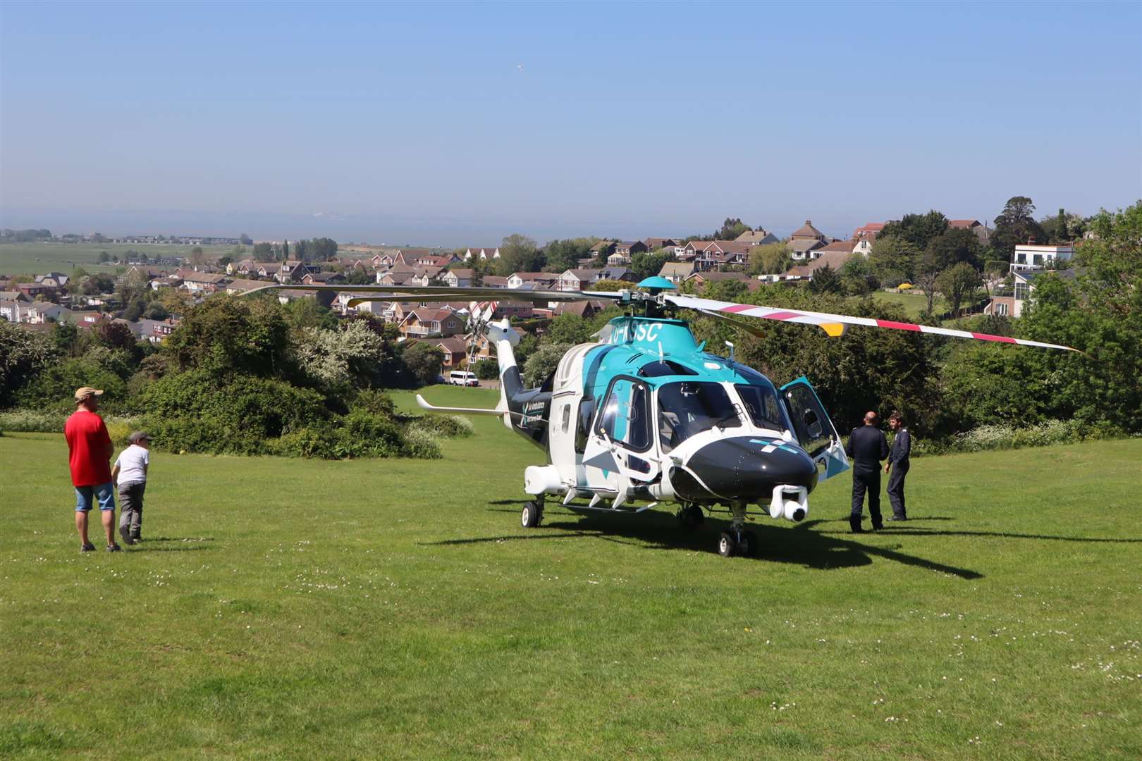 Kent Surrey and Sussex Air Ambulance helicopter landed in The Glen public park at Minster on the Isle of Sheppey