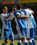 Curtis Weston, Rene Howe and Dennis Oli celebrate as the Gills go 3-0 ahead