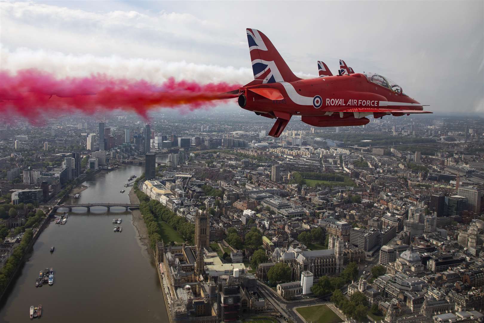 The Royal Air Force Red Arrows flying over Westminster Abbey and the Houses of Parliament (SAC Hannah Smoker/Ministry of Defence/PA)