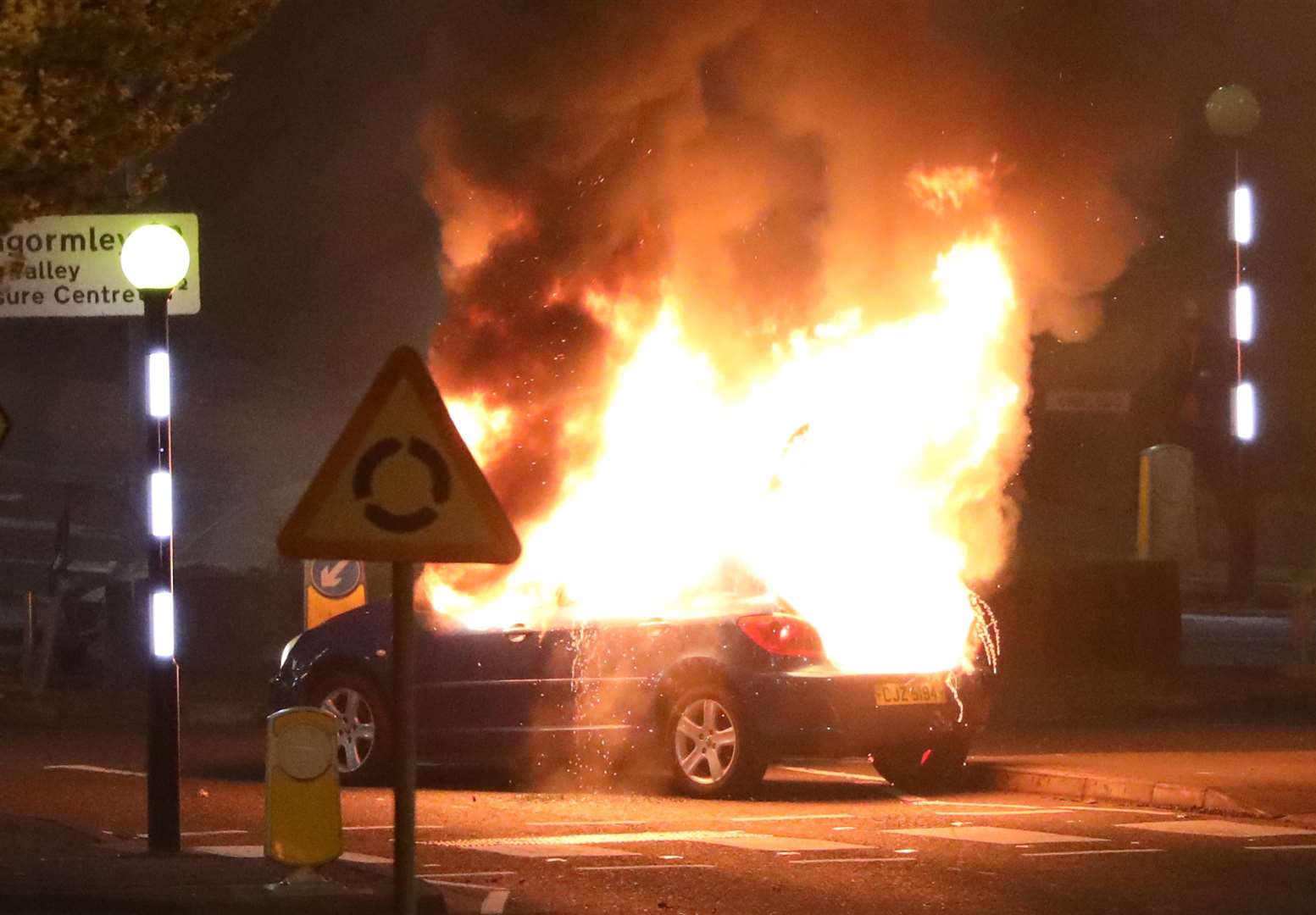 A burning car in Newtownabbey on Saturday night (Peter Morrison/PA)