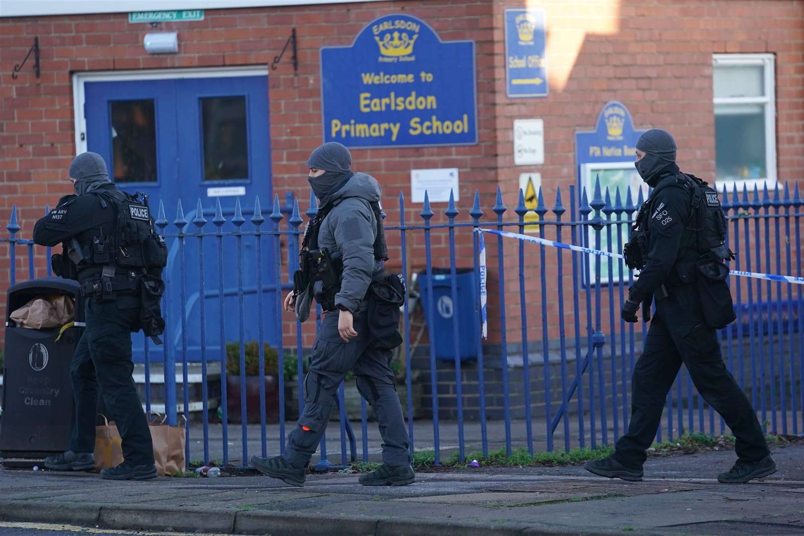 Armed police officers outside Earlsdon Primary school (Jacob King/PA)