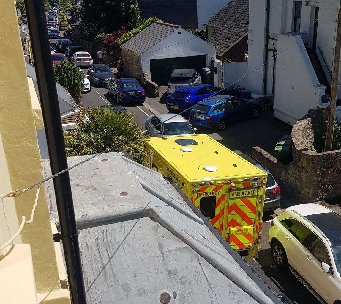 An ambulance struggles to get down Radnor Cliff Road due to inconsiderate parking and traffic jams from day visitors